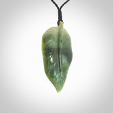 Hand carved New Zealand Jade leaf pendant with adjustable cord. This piece is a stand out work of creativity and skill and we love Raegan Bregmen's creations. Unique, one only, New Zealand made necklace for sale. Free shipping worldwide.
